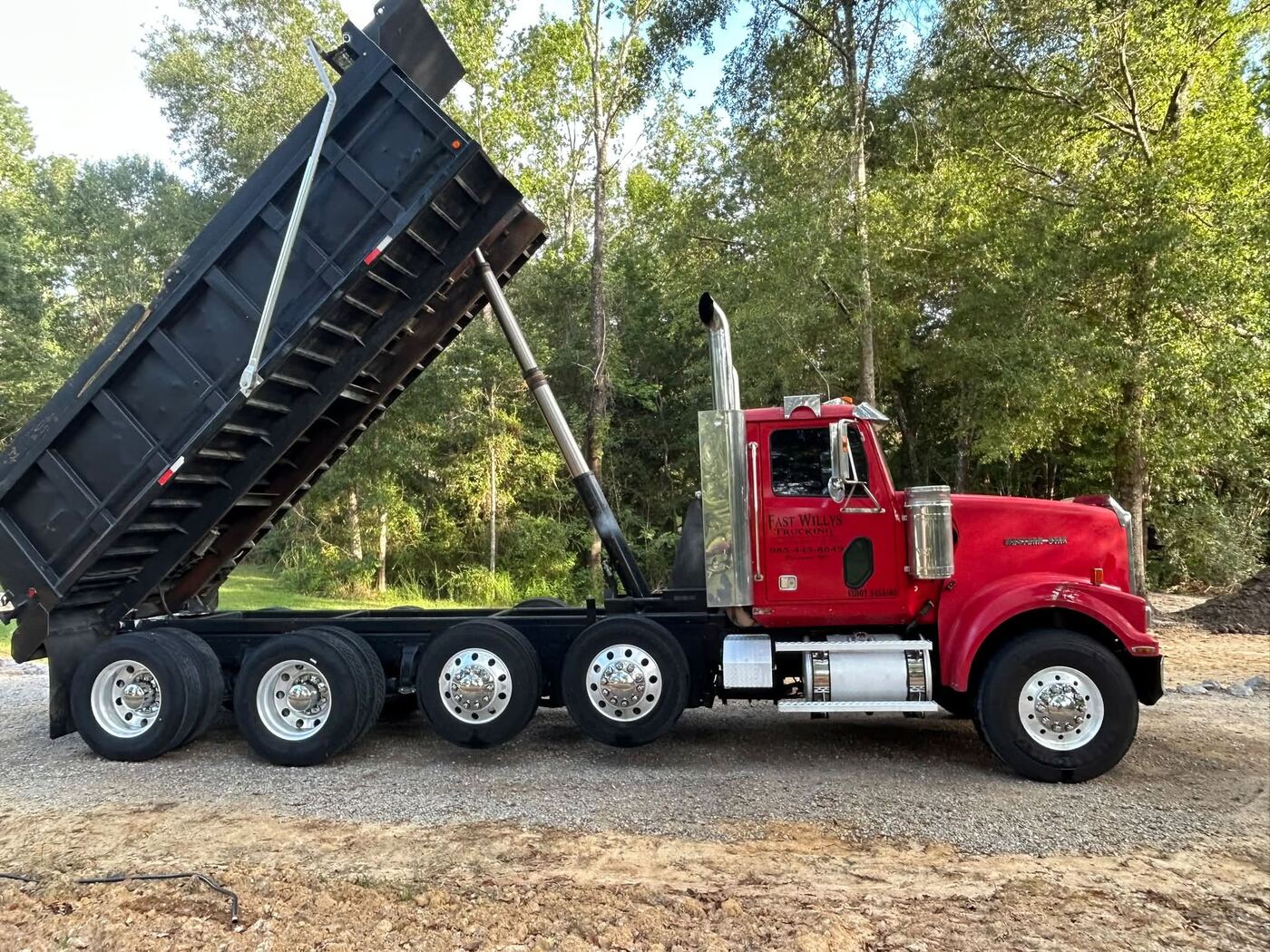 Dump truck delivering fill